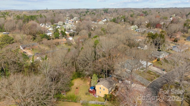 drone / aerial view with a forest view