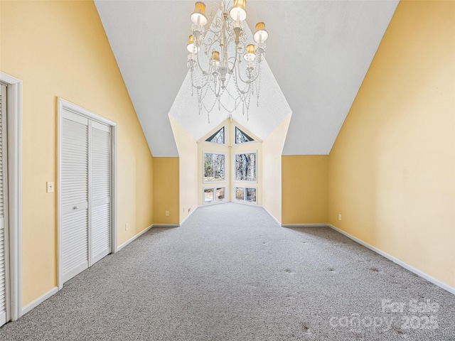 additional living space with baseboards, a notable chandelier, carpet flooring, and vaulted ceiling