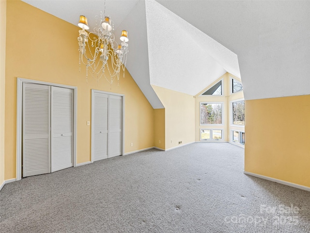 additional living space featuring a chandelier, carpet flooring, a textured ceiling, and baseboards