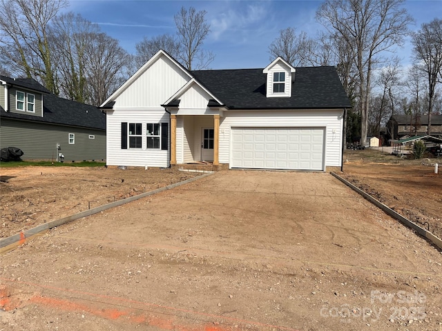 modern inspired farmhouse with driveway, a garage, and roof with shingles