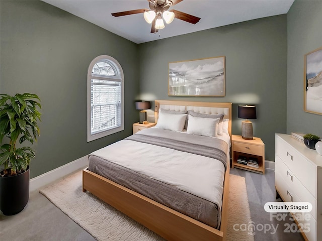 carpeted bedroom with baseboards and a ceiling fan