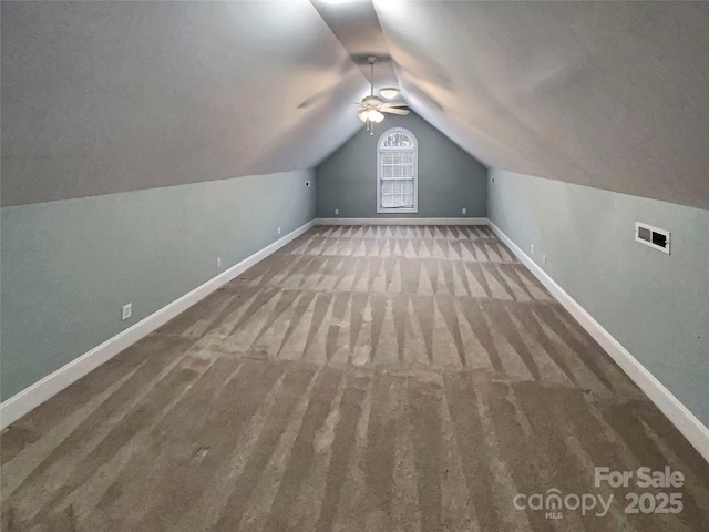 bonus room featuring carpet, visible vents, baseboards, a ceiling fan, and vaulted ceiling