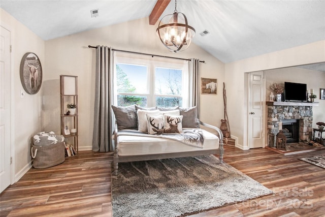 living area with visible vents, vaulted ceiling with beams, an inviting chandelier, and wood finished floors