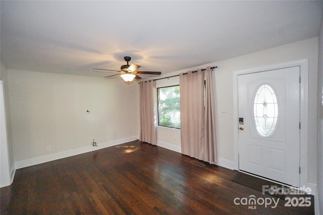 entryway featuring baseboards, a ceiling fan, and wood finished floors