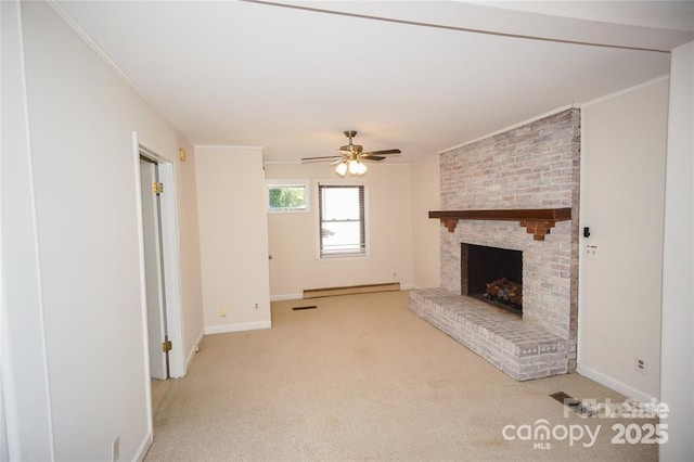 unfurnished living room featuring crown molding, a ceiling fan, baseboard heating, and carpet floors