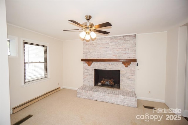 unfurnished living room featuring ornamental molding, a ceiling fan, carpet floors, baseboards, and baseboard heating