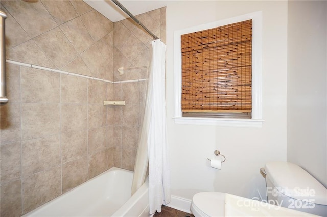 full bathroom with shower / bath combination with curtain and toilet