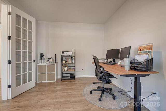 office space featuring wood finished floors and baseboards