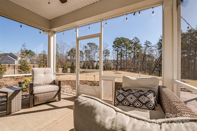 sunroom with a ceiling fan