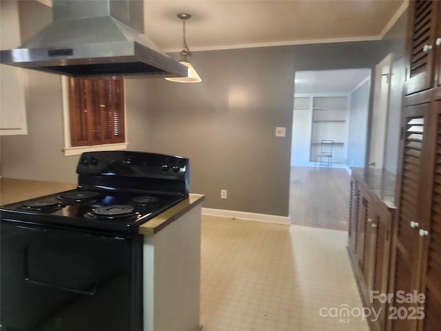 kitchen featuring electric range, crown molding, wall chimney range hood, baseboards, and light floors