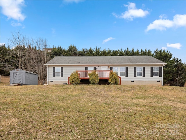 view of front of home with an outbuilding, a wooden deck, a front lawn, a storage unit, and crawl space