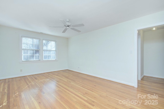 spare room with light wood-style floors, baseboards, and ceiling fan