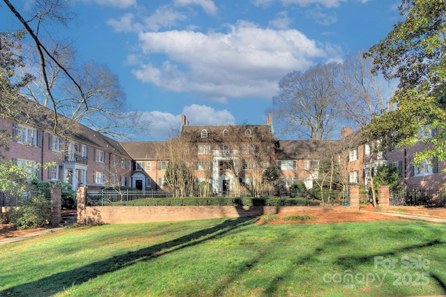 surrounding community with a yard and fence