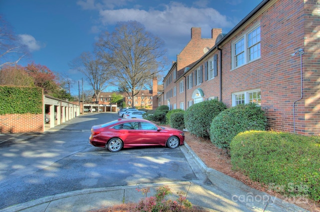 uncovered parking lot with a residential view