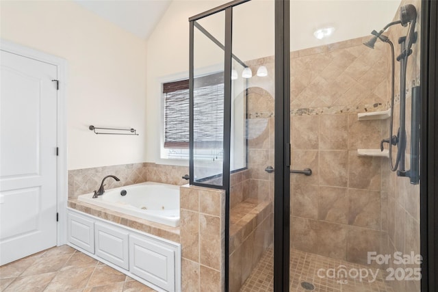 bathroom featuring tile patterned floors, a shower stall, and a whirlpool tub