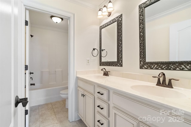 bathroom featuring a sink, toilet, ornamental molding, and double vanity