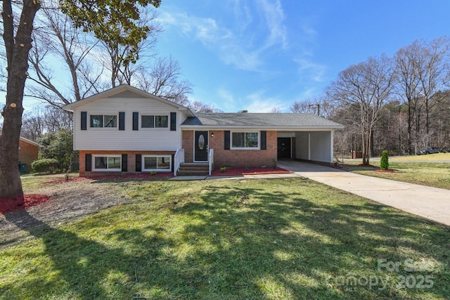 tri-level home featuring brick siding, an attached carport, concrete driveway, and a front lawn