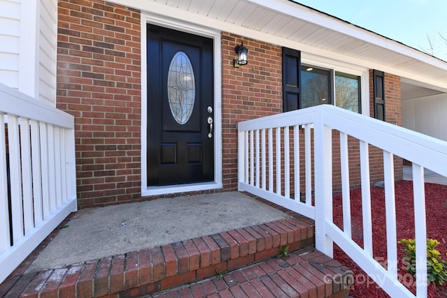 entrance to property with brick siding