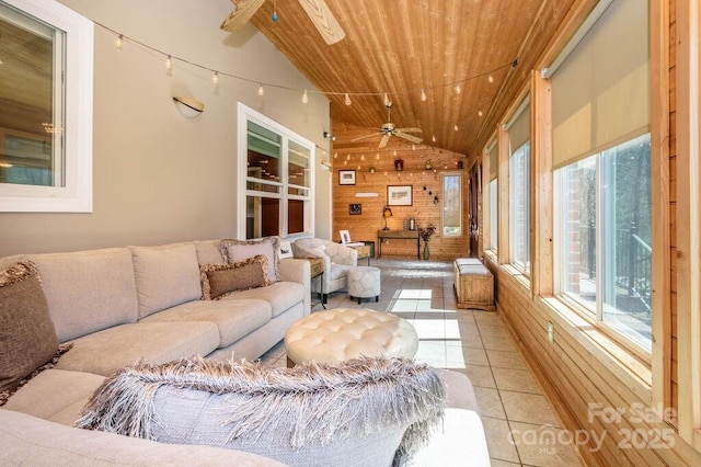 sunroom / solarium featuring wooden ceiling, lofted ceiling, and ceiling fan