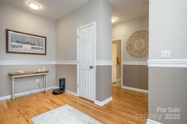 interior space featuring wood finished floors and baseboards