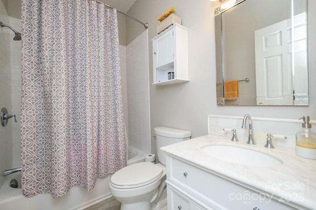 bathroom featuring toilet, vanity, and shower / bathtub combination with curtain