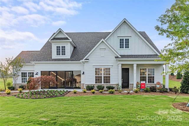 view of front of house featuring a porch, roof with shingles, board and batten siding, and a front lawn