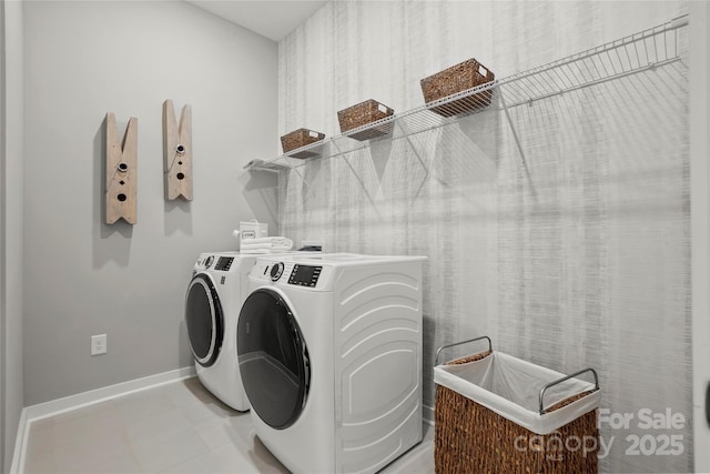 laundry room with laundry area, baseboards, and independent washer and dryer