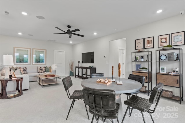 dining space with light carpet, visible vents, recessed lighting, and a ceiling fan