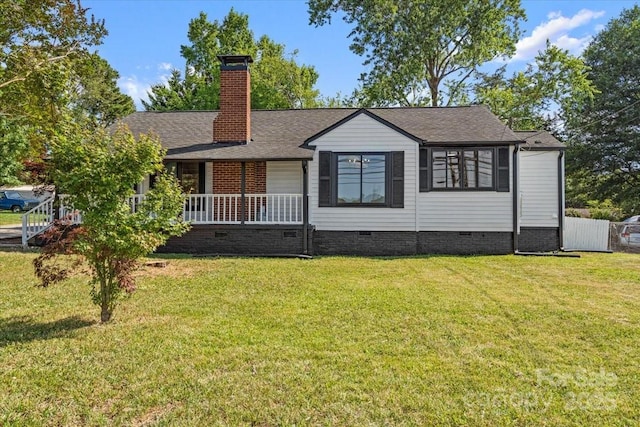 view of front facade featuring covered porch, a front yard, a shingled roof, crawl space, and a chimney