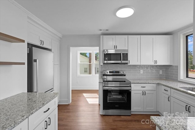 kitchen featuring tasteful backsplash, ornamental molding, appliances with stainless steel finishes, white cabinets, and open shelves