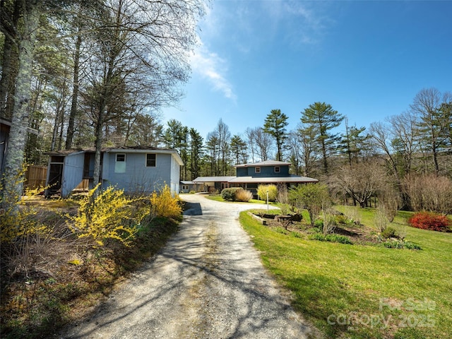 140 Hangin Dog Ln, Lake Toxaway, NC 28747 - view of front of home with a front yard and aphalt driveway