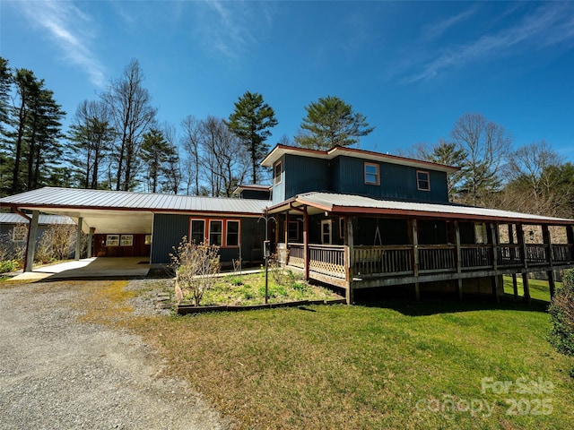 140 Hangin Dog Ln, Lake Toxaway, NC 28747 - view of front facade featuring dirt driveway, a front lawn, an attached carport, and metal roof