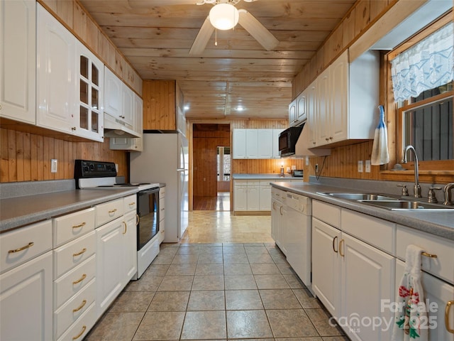 140 Hangin Dog Ln, Lake Toxaway, NC 28747 - kitchen featuring wooden ceiling, wooden walls, a sink, and white appliances