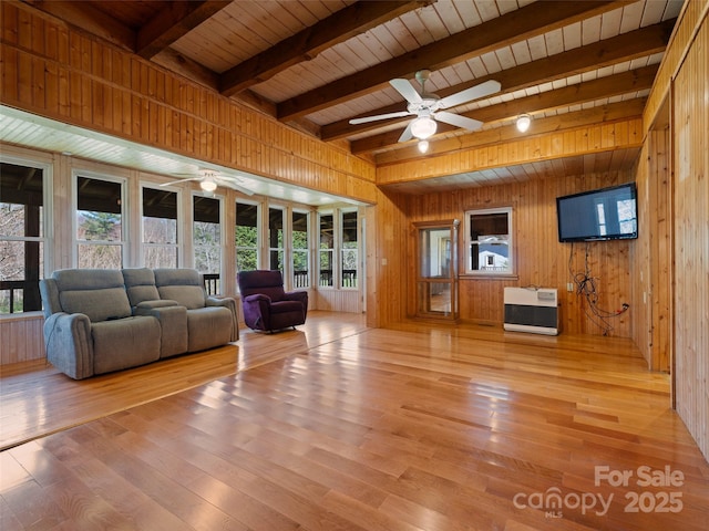 140 Hangin Dog Ln, Lake Toxaway, NC 28747 - unfurnished living room with a healthy amount of sunlight, wooden walls, and a ceiling fan