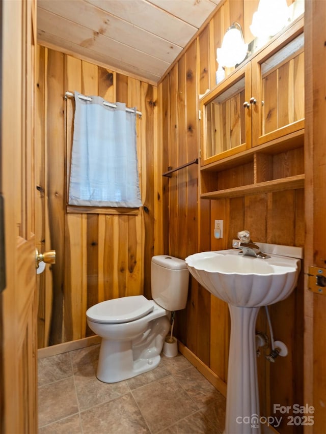 140 Hangin Dog Ln, Lake Toxaway, NC 28747 - bathroom featuring wood walls, toilet, and wood ceiling