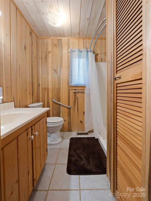 140 Hangin Dog Ln, Lake Toxaway, NC 28747 - full bath with toilet, tile patterned floors, wooden ceiling, and wood walls