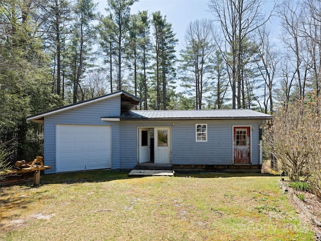 140 Hangin Dog Ln, Lake Toxaway, NC 28747 - view of front of property featuring a garage, a front yard, and metal roof