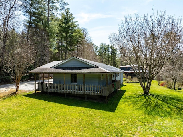 140 Hangin Dog Ln, Lake Toxaway, NC 28747 - view of front of home featuring a front yard, driveway, and roof with shingles