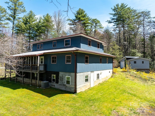 140 Hangin Dog Ln, Lake Toxaway, NC 28747 - back of house with central AC, metal roof, and a lawn