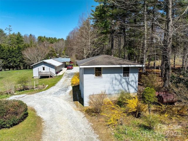 140 Hangin Dog Ln, Lake Toxaway, NC 28747 - view of home's exterior featuring dirt driveway and an outdoor structure