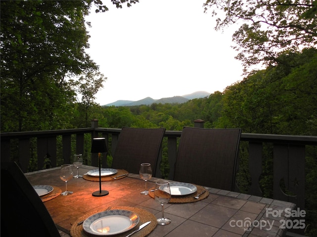 balcony featuring an outdoor fire pit and a mountain view