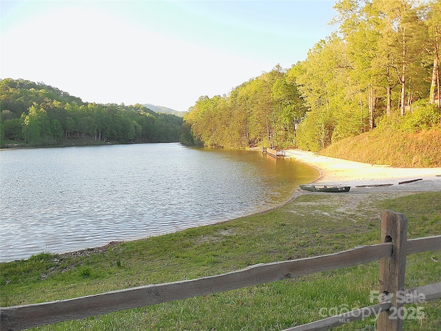 property view of water with a view of trees