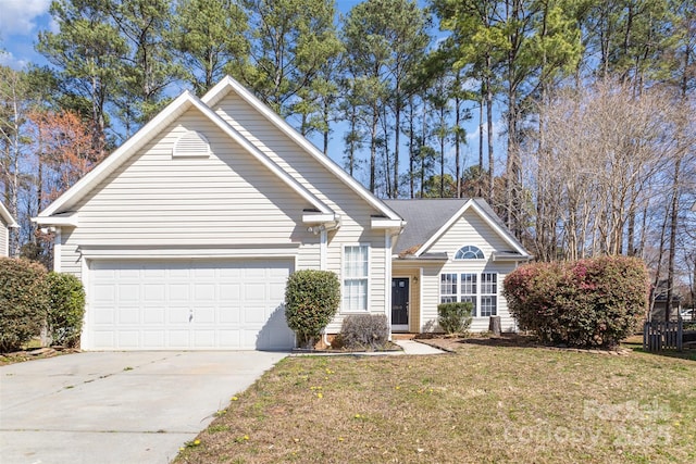 traditional-style house featuring a garage, driveway, and a front lawn