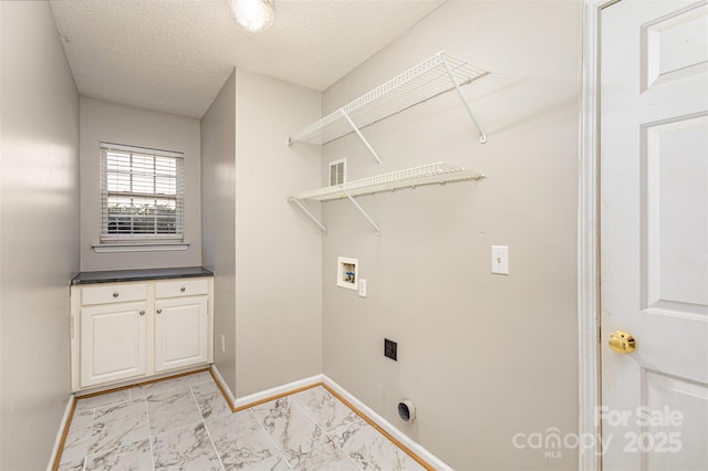 washroom with electric dryer hookup, marble finish floor, washer hookup, baseboards, and laundry area