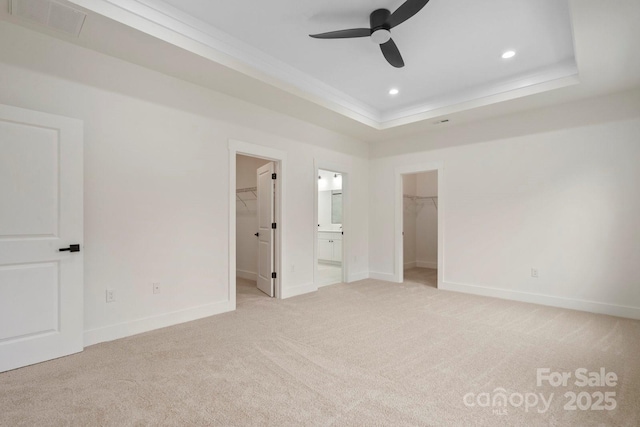 10405 Briarhurst Pl Unit 18, Mint Hill, NC 28227 - unfurnished bedroom featuring a spacious closet, light carpet, a closet, ornamental molding, and baseboards