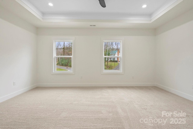 10405 Briarhurst Pl Unit 18, Mint Hill, NC 28227 - carpeted spare room featuring a tray ceiling, plenty of natural light, crown molding, baseboards, and recessed lighting