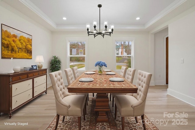 10405 Briarhurst Pl Unit 18, Mint Hill, NC 28227 - dining area featuring a tray ceiling, a chandelier, light wood-type flooring, ornamental molding, and baseboards