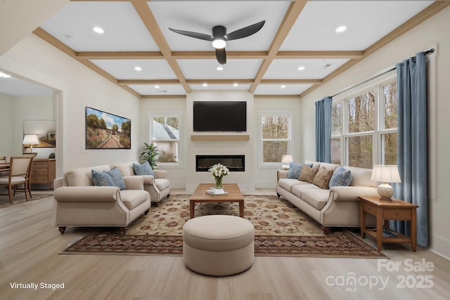 10405 Briarhurst Pl Unit 18, Mint Hill, NC 28227 - living area with coffered ceiling, wood finished floors, ceiling fan, beam ceiling, and a glass covered fireplace