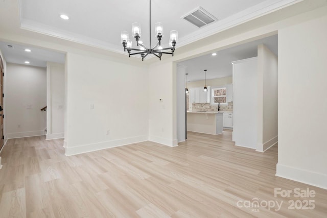 10405 Briarhurst Pl Unit 18, Mint Hill, NC 28227 - empty room featuring a chandelier, light wood-type flooring, crown molding, baseboards, and recessed lighting