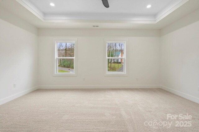 10405 Briarhurst Pl Unit 18, Mint Hill, NC 28227 - unfurnished room featuring a raised ceiling, light colored carpet, plenty of natural light, ornamental molding, and recessed lighting